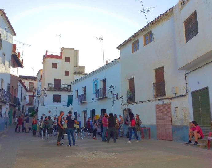 People in an outdoor urban setting — Participants engaging together in an outdoor community space.